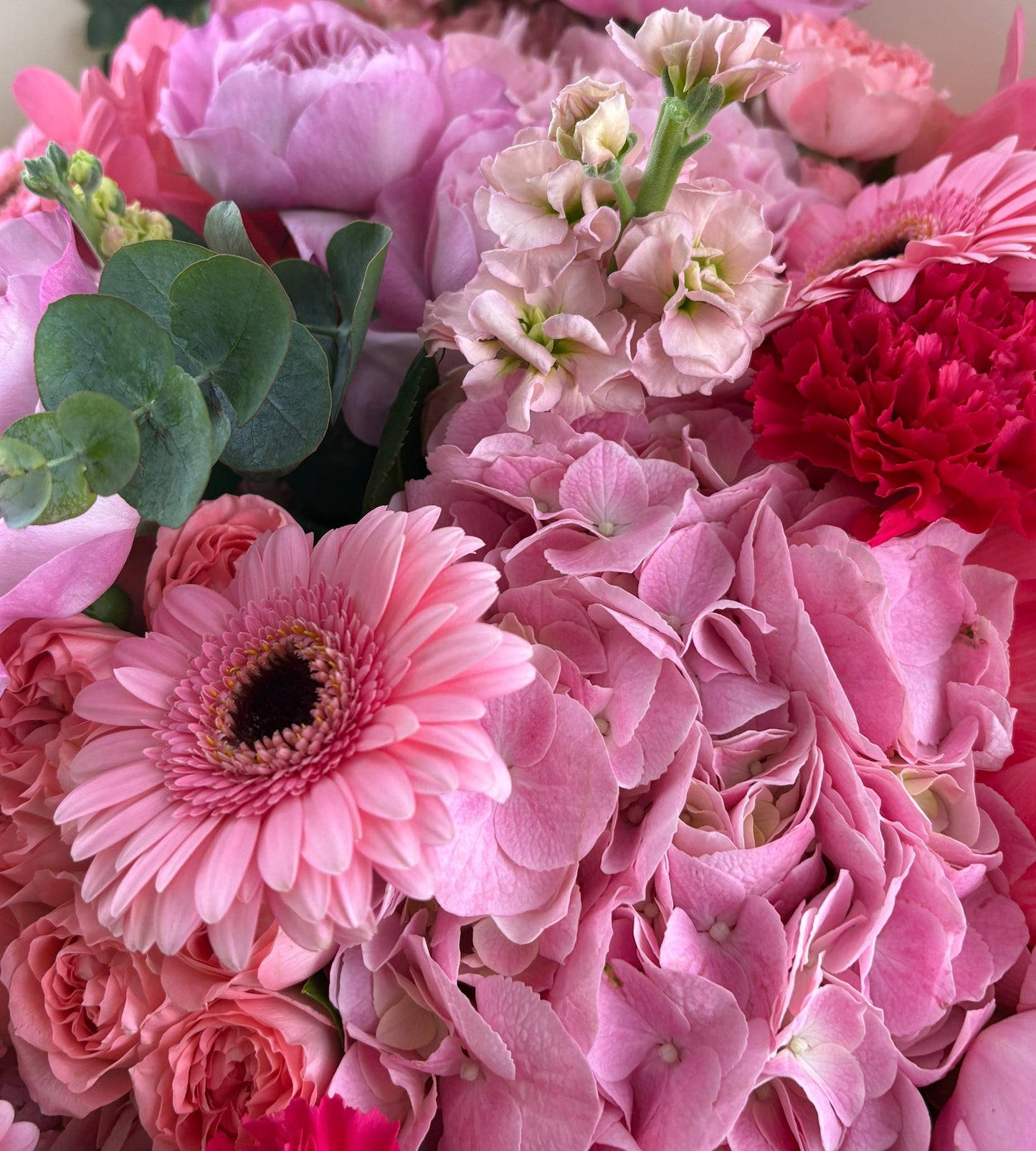 Pink flower bouquet with roses and carnations, perfect for joyful occasions and heartfelt gifts.