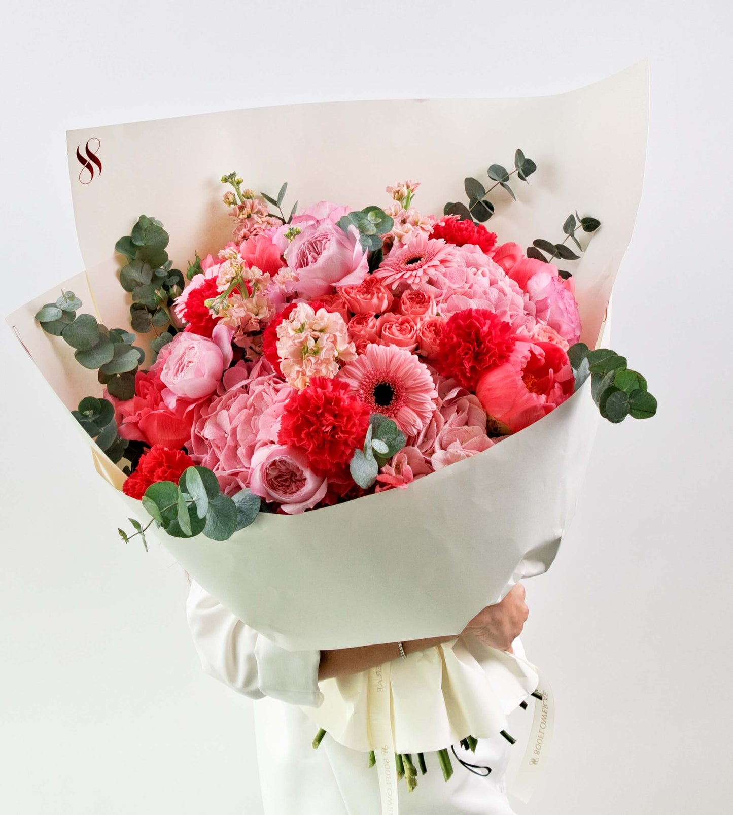 Pink flower bouquet with roses and carnations, perfect for joyful occasions and heartfelt gifts.