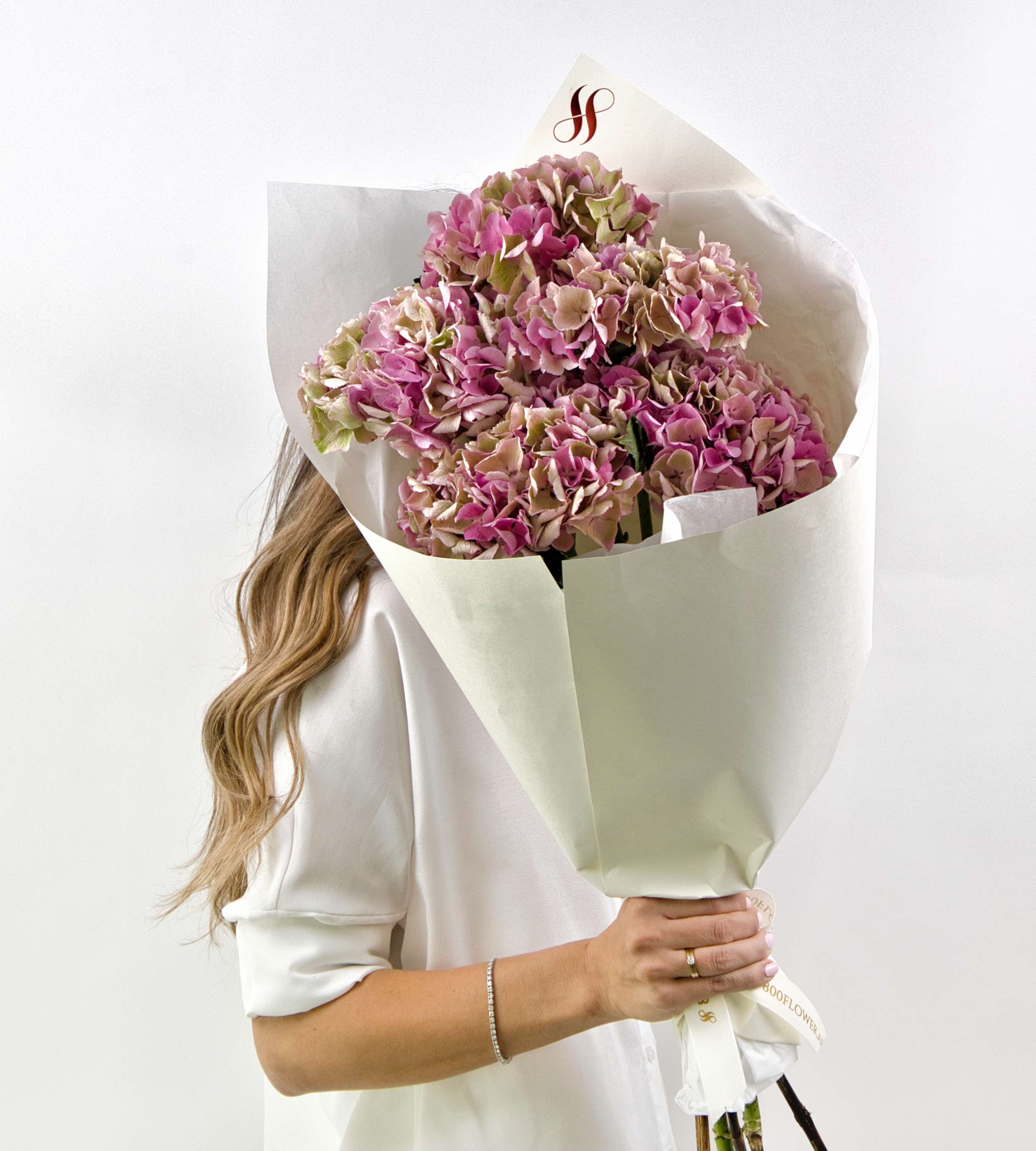 Pink and antique toned hydrangea bouquet with lush soft petals.