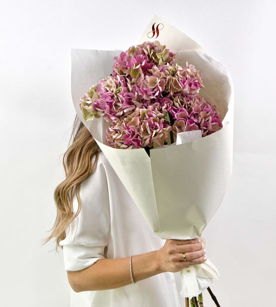 Pink and antique toned hydrangea bouquet with lush soft petals.
