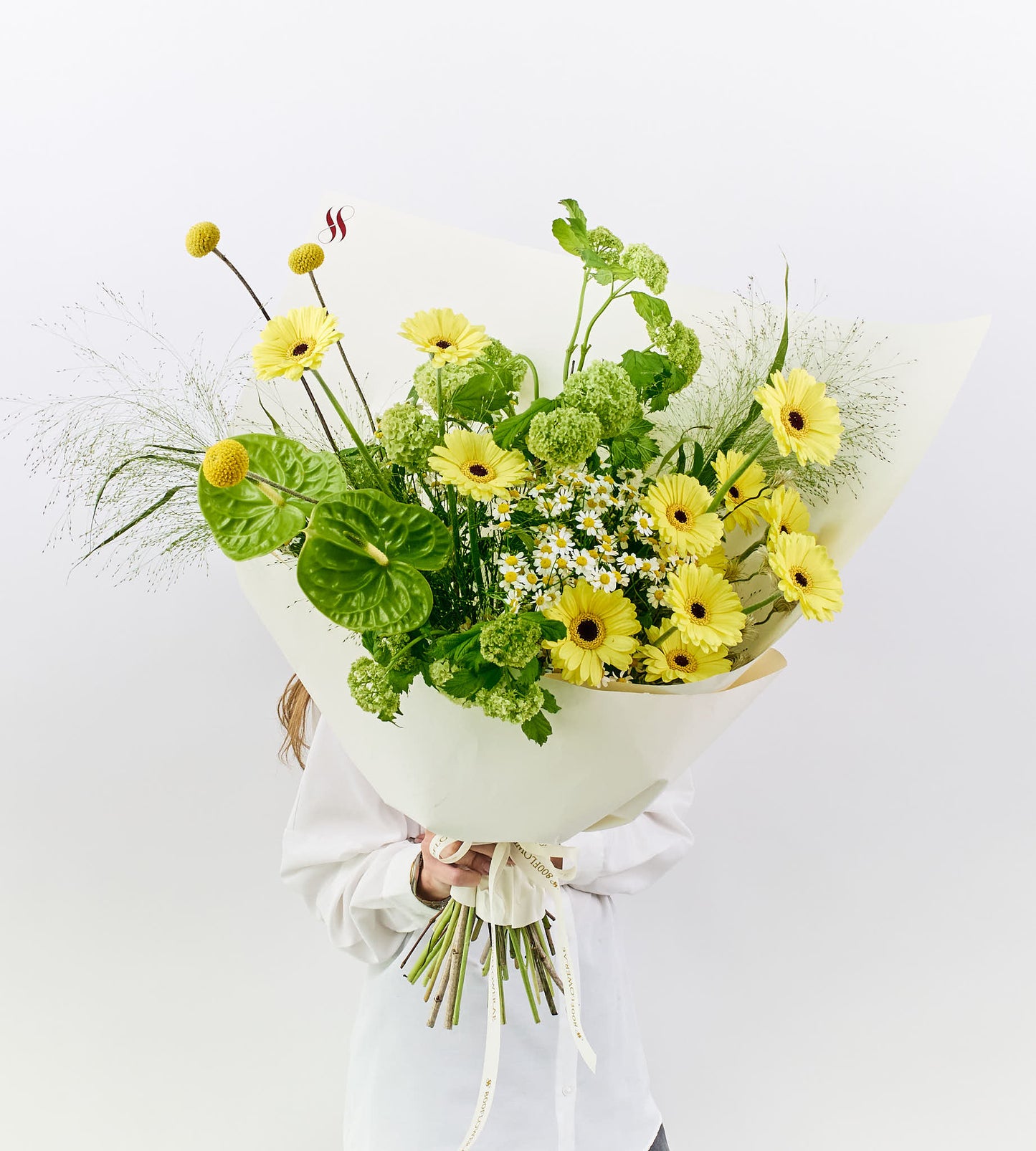 Bright yellow flower bouquet with textured petals.