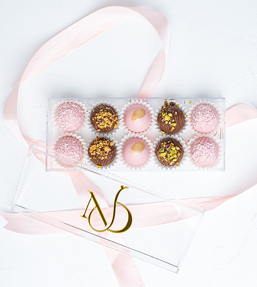 Gift box with 10 assorted truffles filled with peanut butter, pistachio, almond, and lotus flavors – tray size 20 by 8 cm