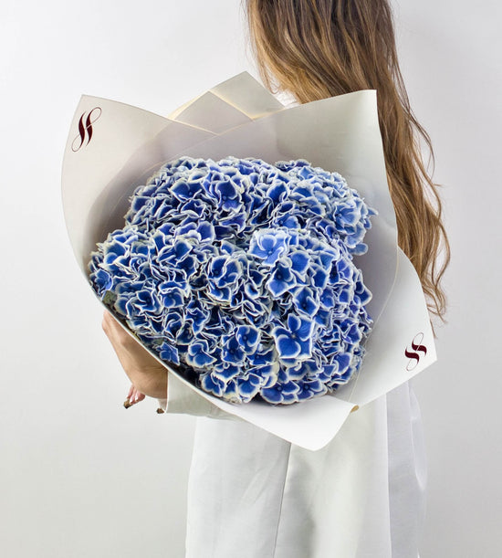 Elegant blue hydrangeas bouquet ideal for birthdays, anniversaries, or home decor.