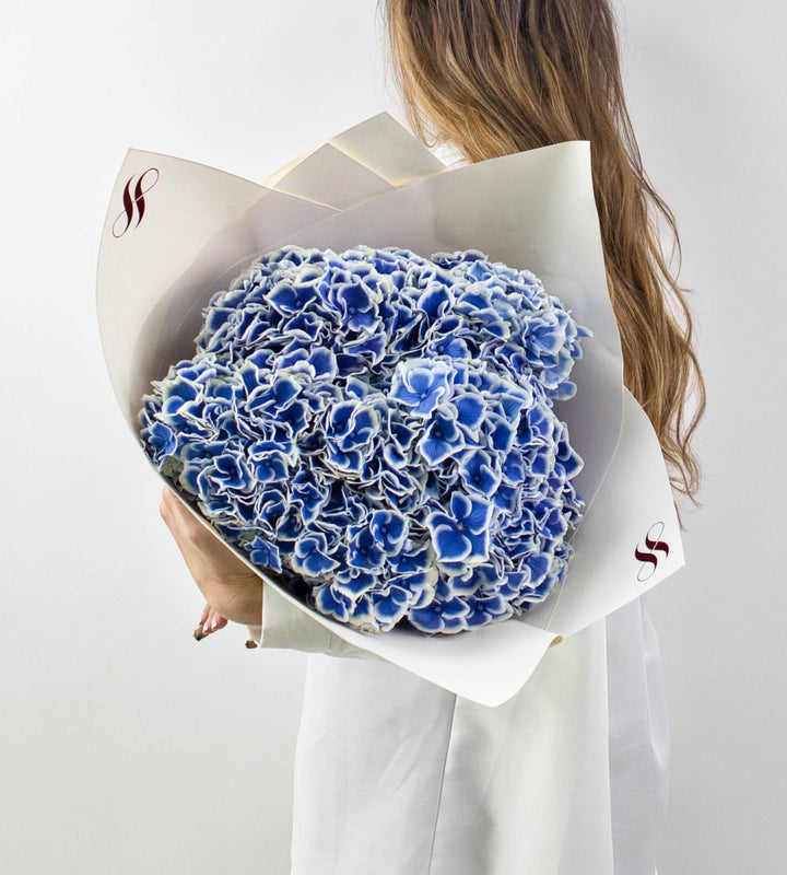 Elegant blue hydrangeas bouquet ideal for birthdays, anniversaries, or home decor.
