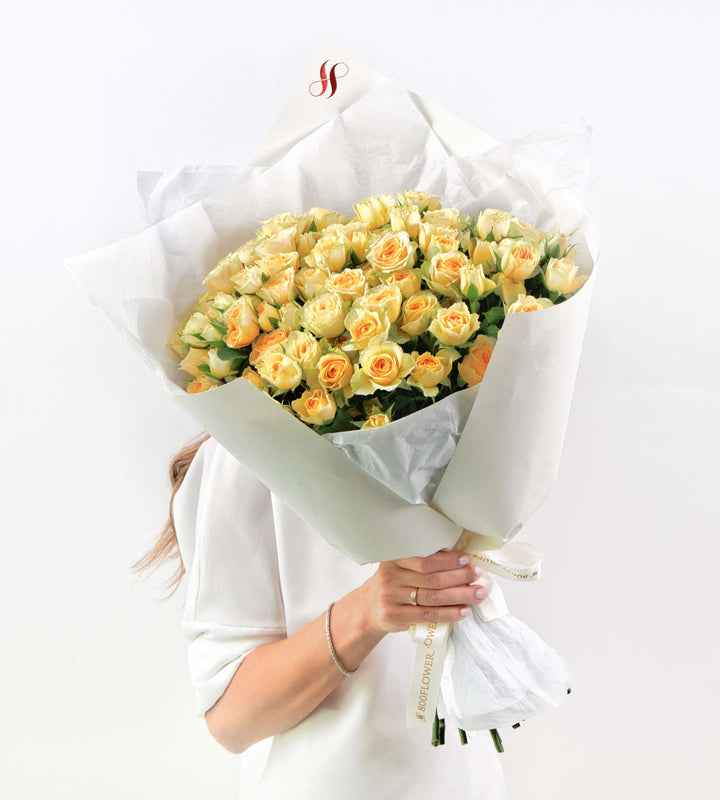 Radiant soft yellow rose bouquet full of fresh, bright petals.
