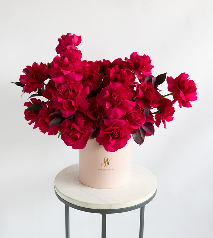 Petite round Vienna box floral arrangement, a subtle and alluring gift expressing admiration and fascination.