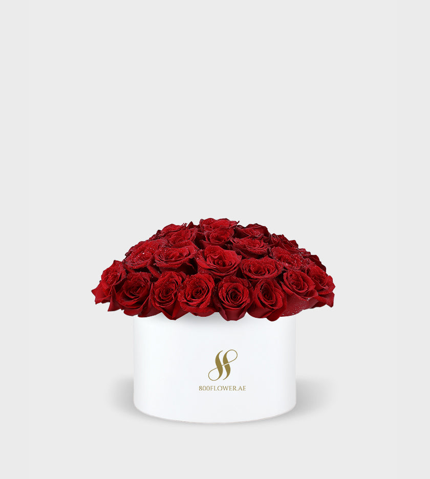 Red Rose Small Round Box with 30 meticulously arranged red roses, symbolizing passionate love, desire, and timeless affection.