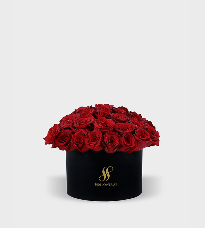 Red Rose Small Round Box with 30 meticulously arranged red roses, symbolizing passionate love, desire, and timeless affection.