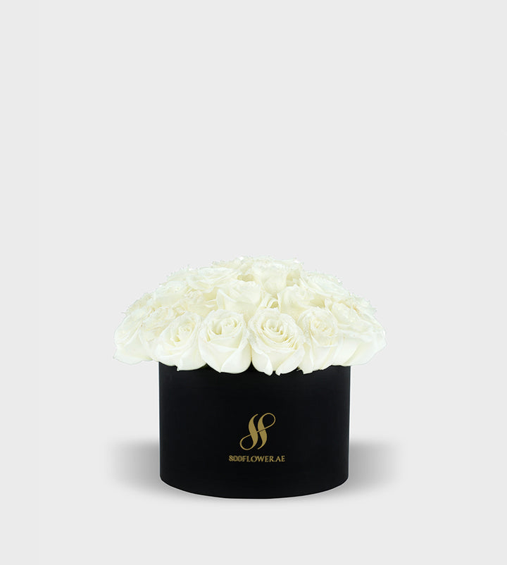 White Rose Small Round Box featuring 30 pristine white roses, elegantly arranged to symbolize purity, innocence, and heartfelt emotions.