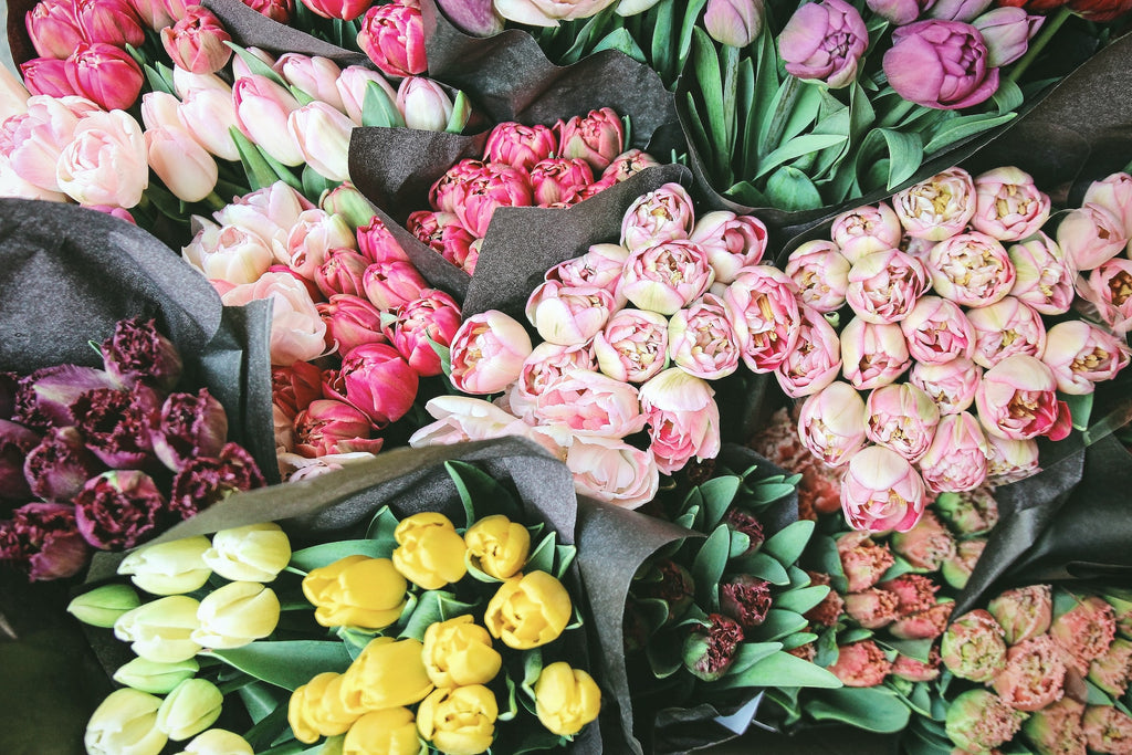 A florist uses four color schemes for flower arrangements