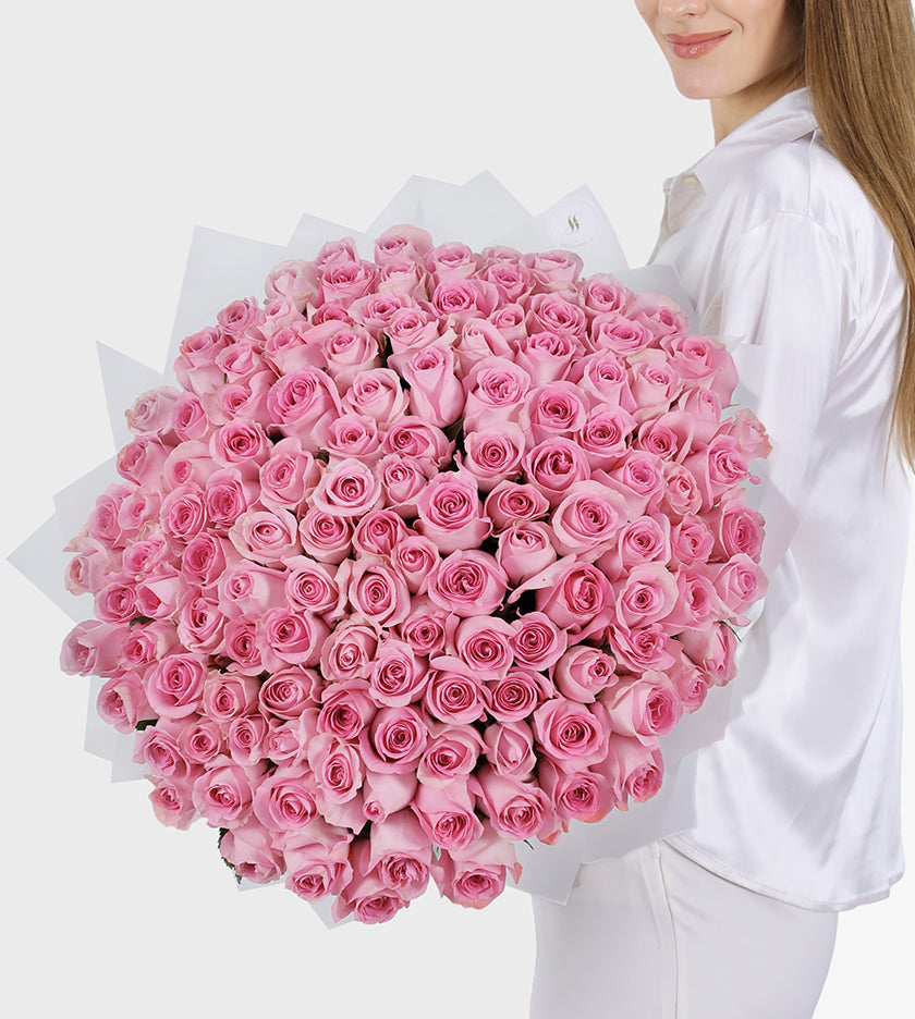 Embrace luxury with our 100 pink&nbsp;blooms of elegance, mystery, and admiration. A lavish statement for any occasion.