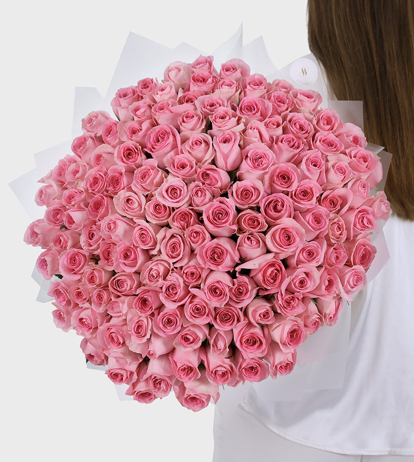 Luxury bouquet of 100 pink roses symbolizing elegance, mystery, and admiration – perfect floral gift for any occasion