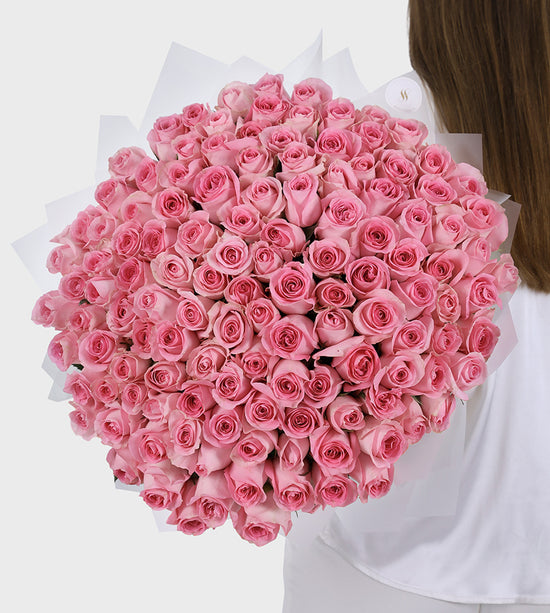 Luxury bouquet of 100 pink roses symbolizing elegance, mystery, and admiration – perfect floral gift for any occasion