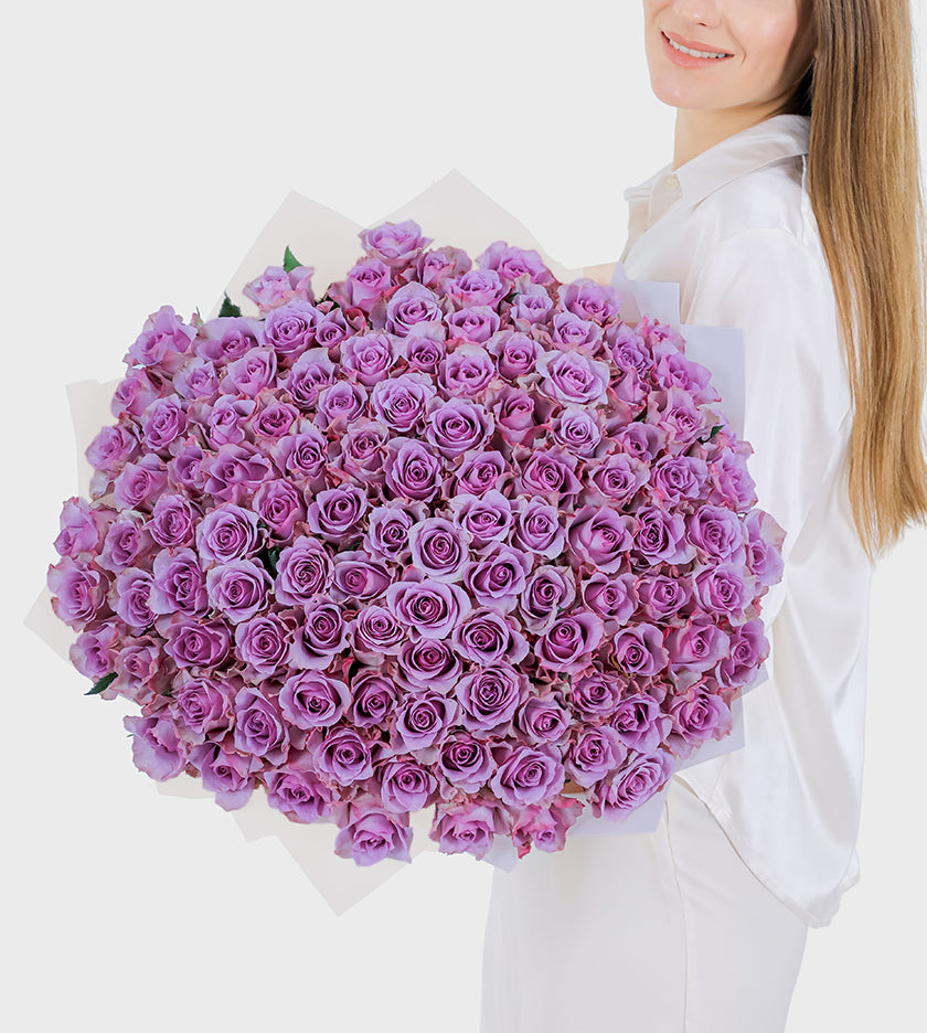 Luxury bouquet of 100 purple roses symbolizing elegance, mystery, and admiration – perfect floral gift for any occasion