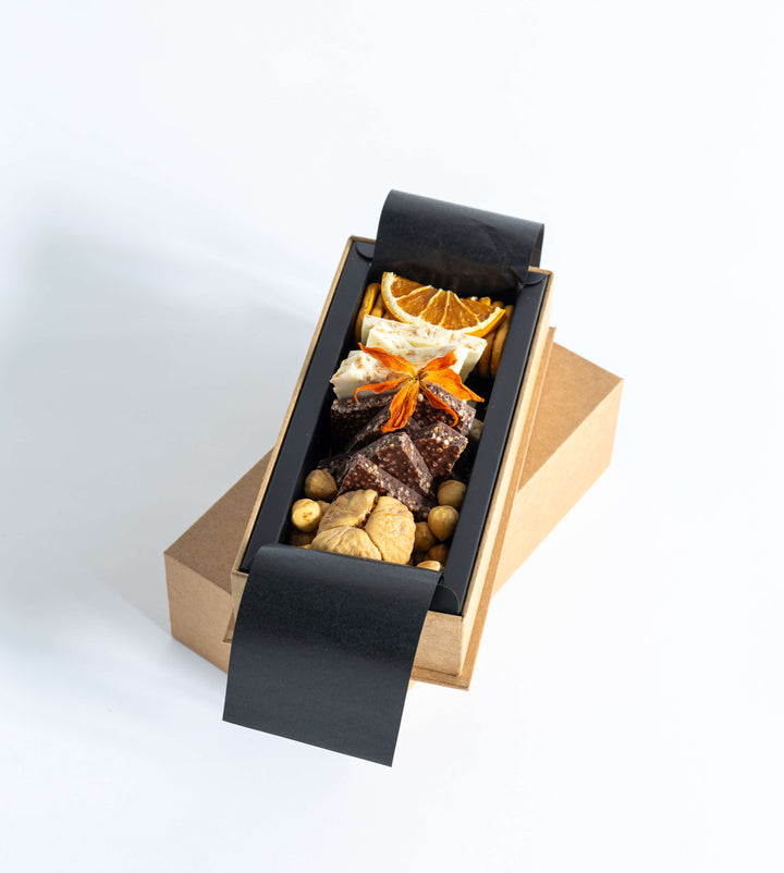 The “Me Platter” blends velvety “Lait De Noir with Puffed Quinoa” and crisp “Blanc De Blancs with Crepe Flakes,” paired with figs, hazelnuts, and pretzels for a perfect balance of sweet, savory, and crunch.
