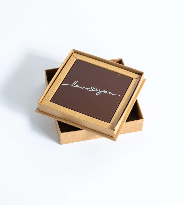 Lait De Noir blends rich cacao with creamy milk, creating a velvety softness that lingers on the palate.