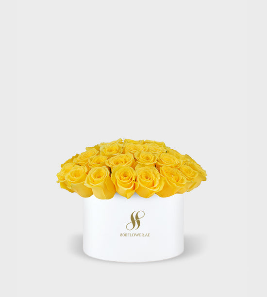 Yellow Rose Small Round Box featuring 30 vibrant yellow roses, arranged to convey warmth, joy, and cheerful positivity.