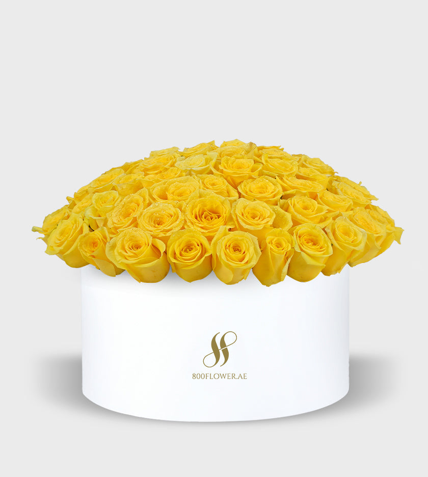 Yellow Roses Small Round Box with 70 radiant yellow roses, symbolizing joy, warmth, happiness, and friendship.