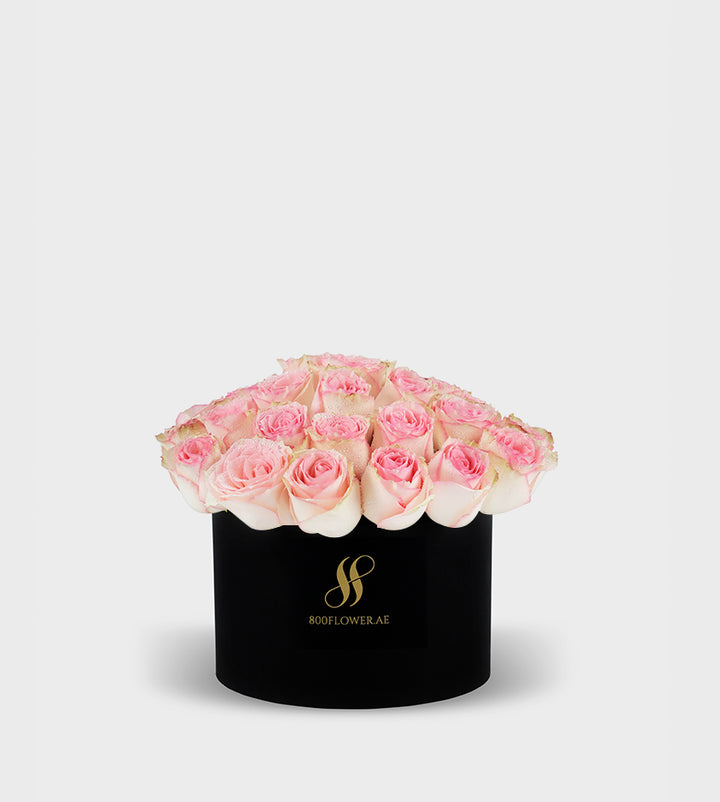 Pink Rose Small Round Box with 30 delicate pink roses, symbolizing grace, admiration, and heartfelt affection.