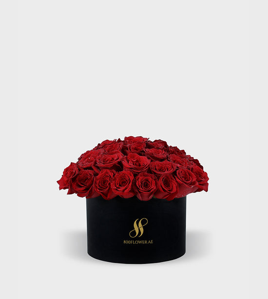 Red Rose Small Round Box with 30 meticulously arranged red roses, symbolizing passionate love, desire, and timeless affection.